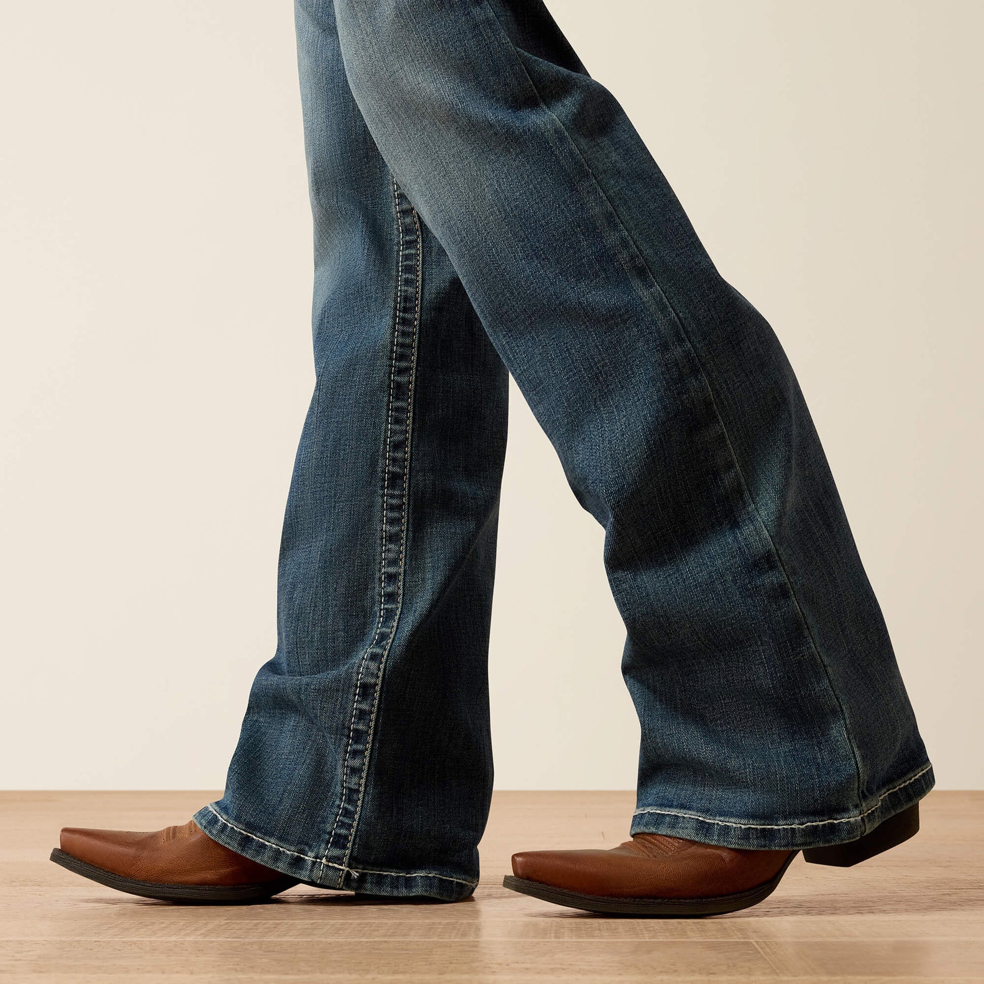 R.E.A.L. Mid Rise Stretch Whipstitch Boot Cut Jean